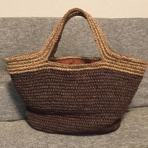Woven brown and tan beach bag with cinch cord